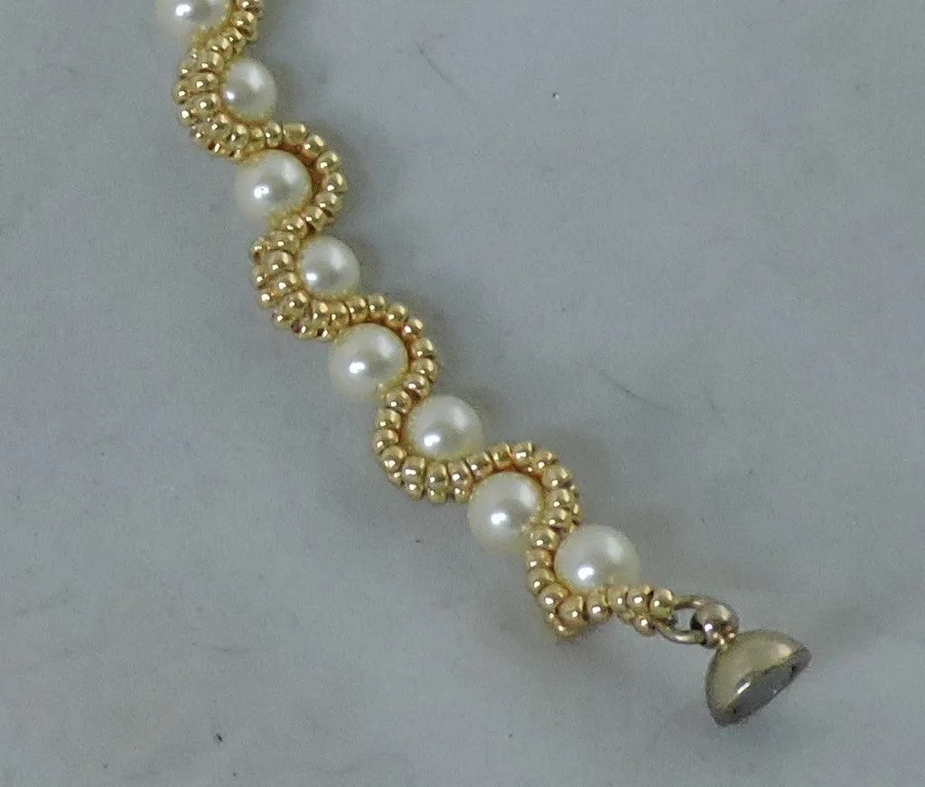 Bracelet with Swarovski Cream Pearls encased with Gold Beads