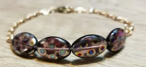 Hand Crafted, Painted Purple Millefiori Glass & Gold Tone Chain Bracelet. Adjustable to 8.5" with Lobster Claw Clasp