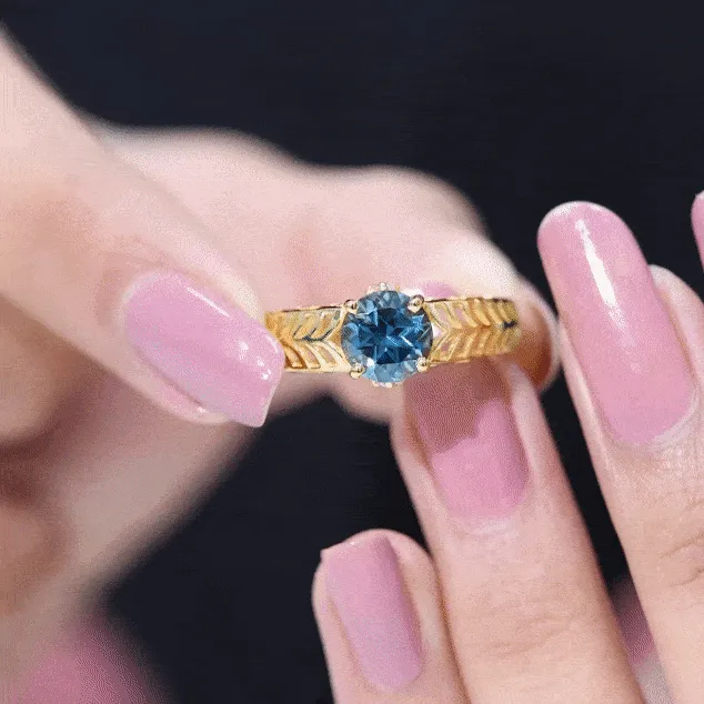 Round London Blue Topaz Solitaire Ring in Cut Out Work