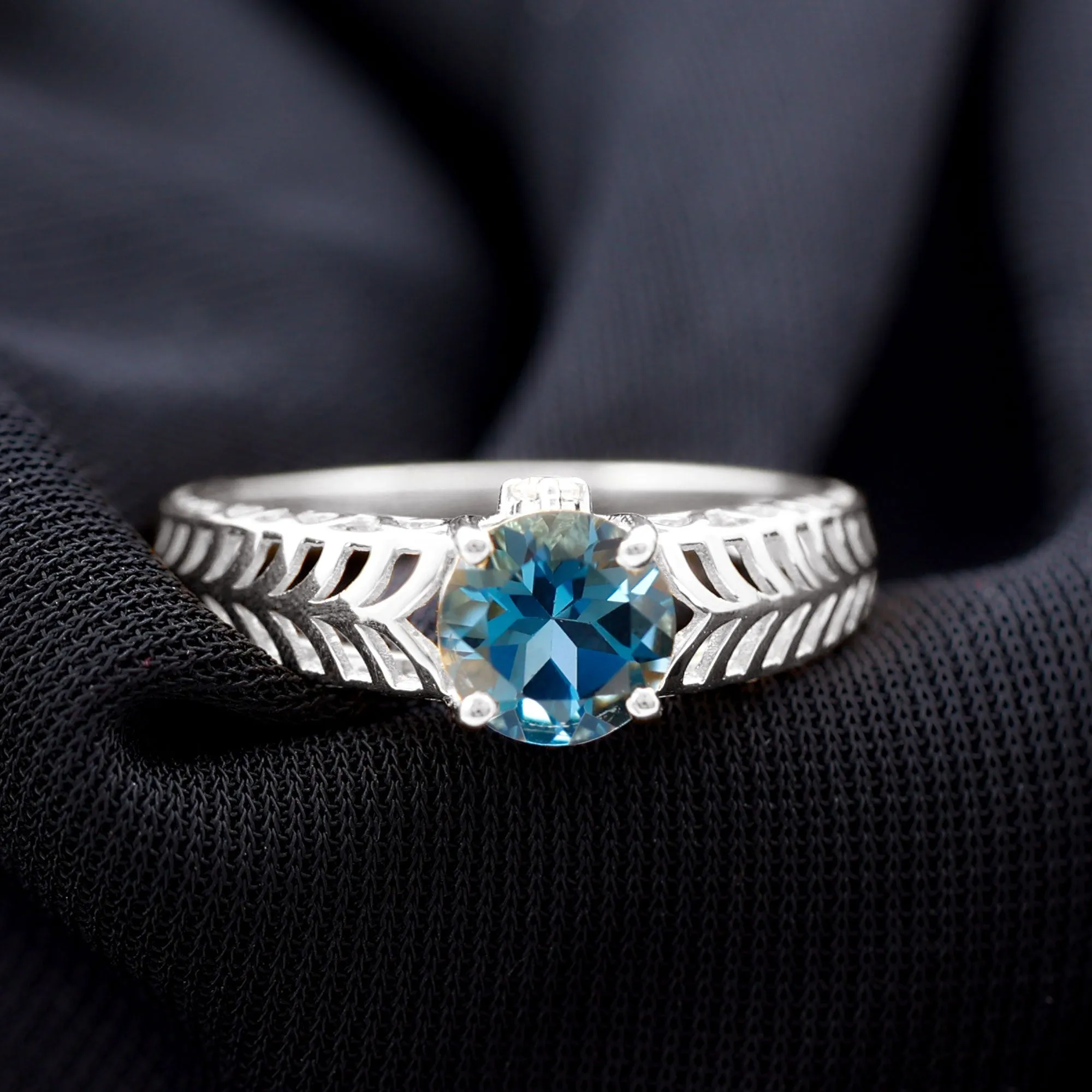 Round London Blue Topaz Solitaire Ring in Cut Out Work