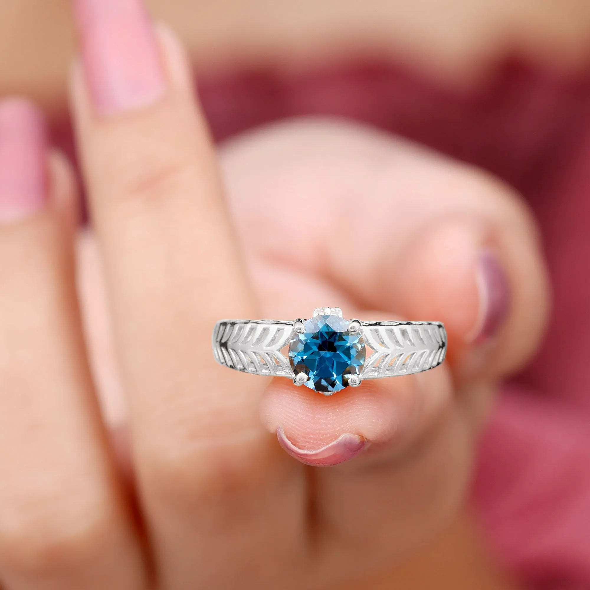 Round London Blue Topaz Solitaire Ring in Cut Out Work