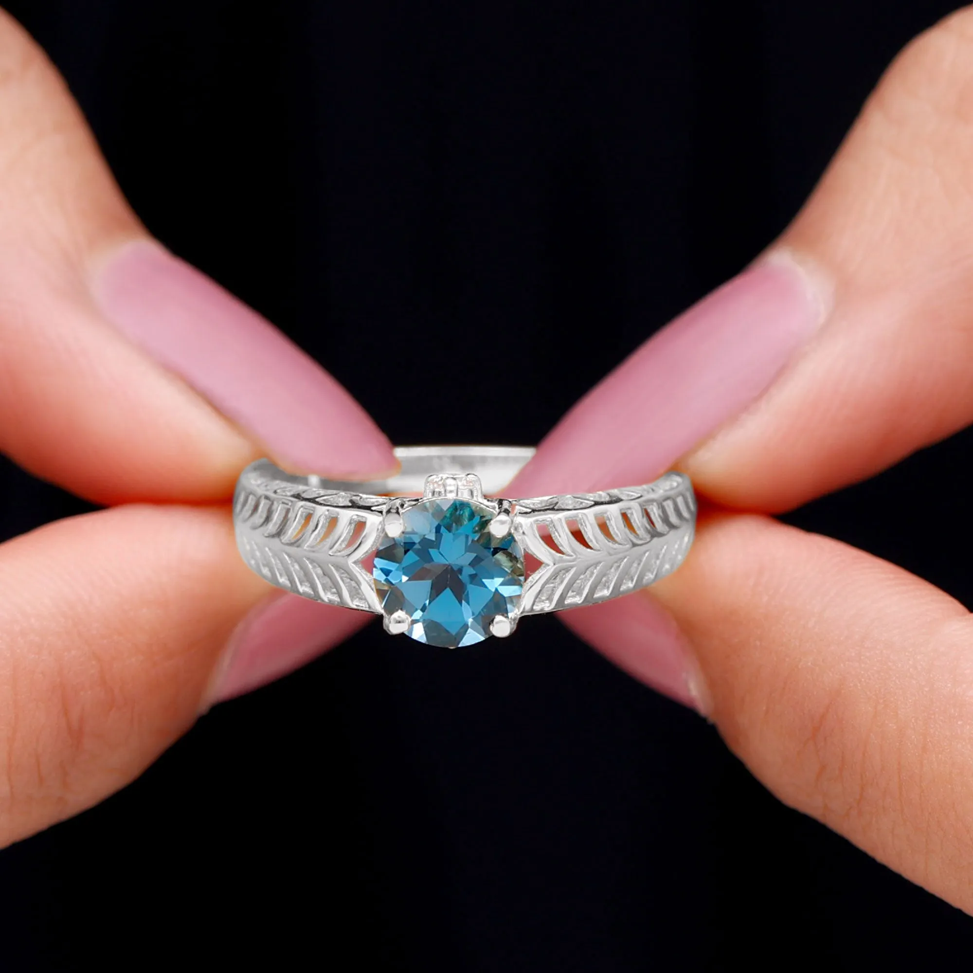 Round London Blue Topaz Solitaire Ring in Cut Out Work