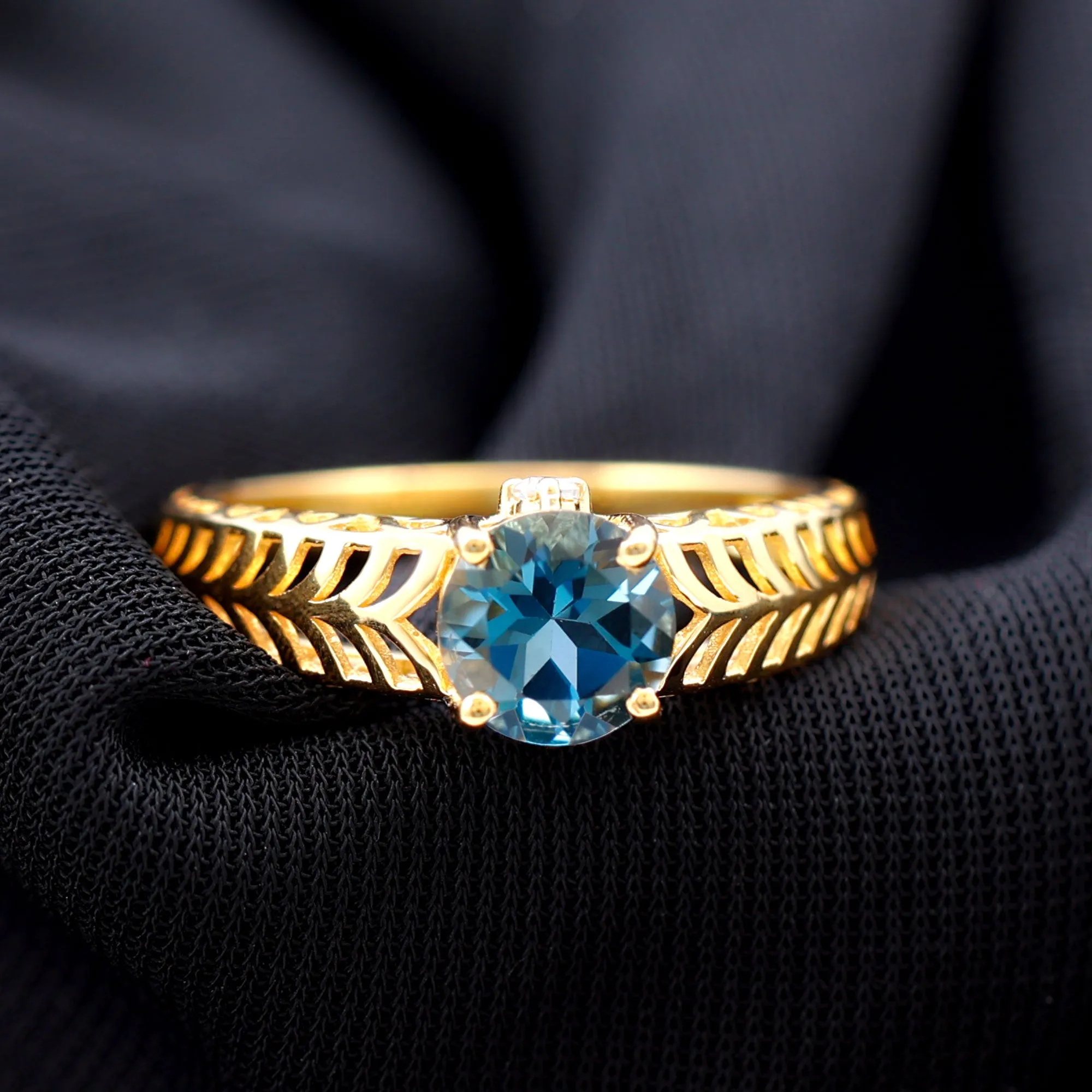Round London Blue Topaz Solitaire Ring in Cut Out Work